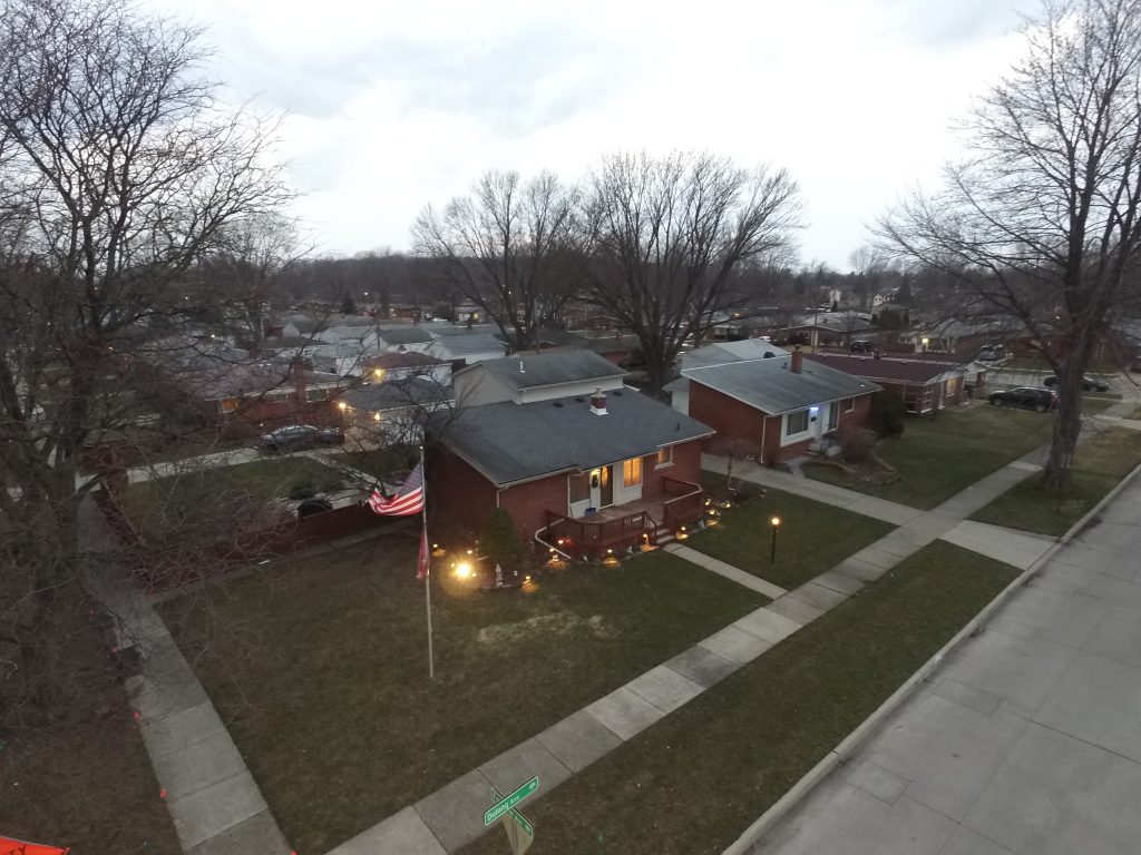 Aerial overview of a residential property and surrounding area.